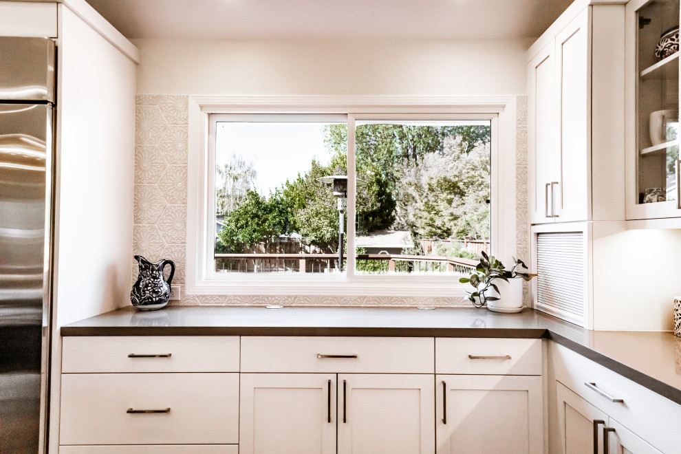 Custom kitchen countertop and window by Heartwood Residential Design + Build 